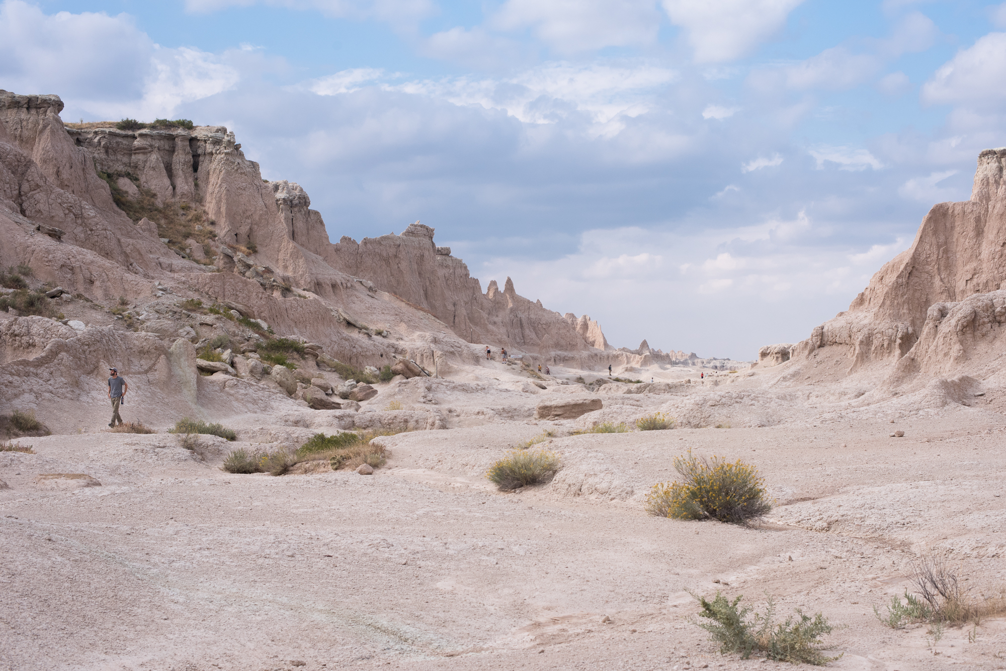 People hiking at Badlands National Park