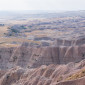 Layers of rock and grassland at Badlands National Park